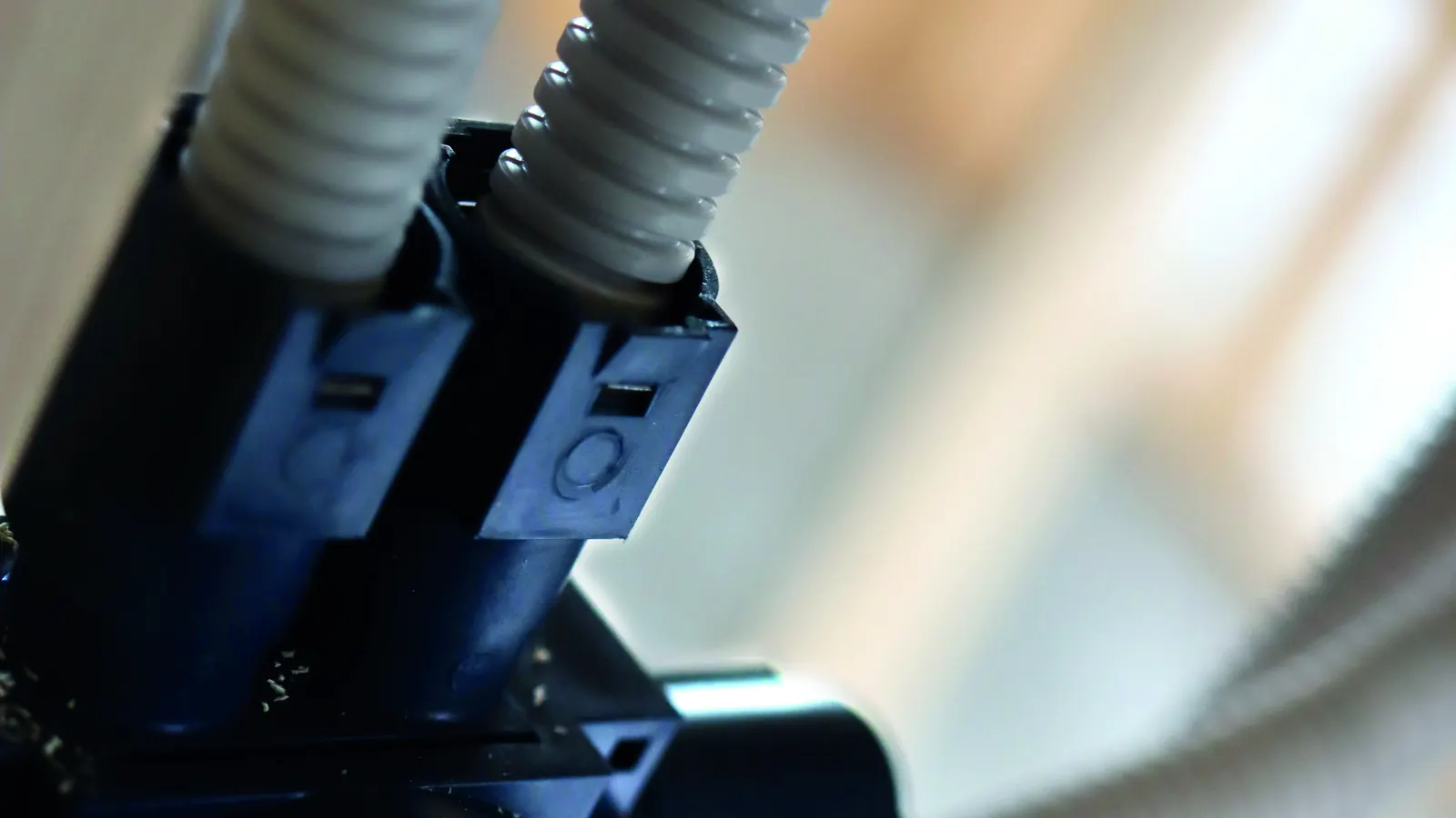 Close-up of conduit entries on a blue installation box