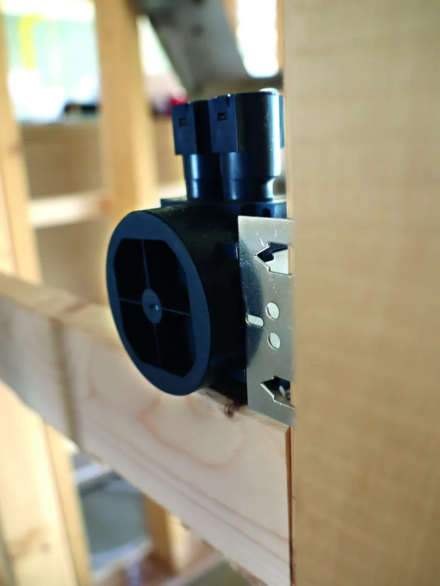 Single blue installation box fixed beside a timber stud before boarding